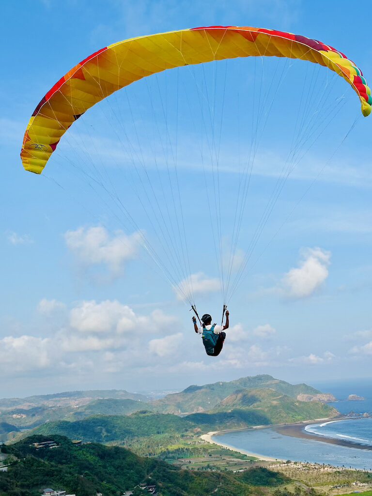 Paragliding Pilot flying