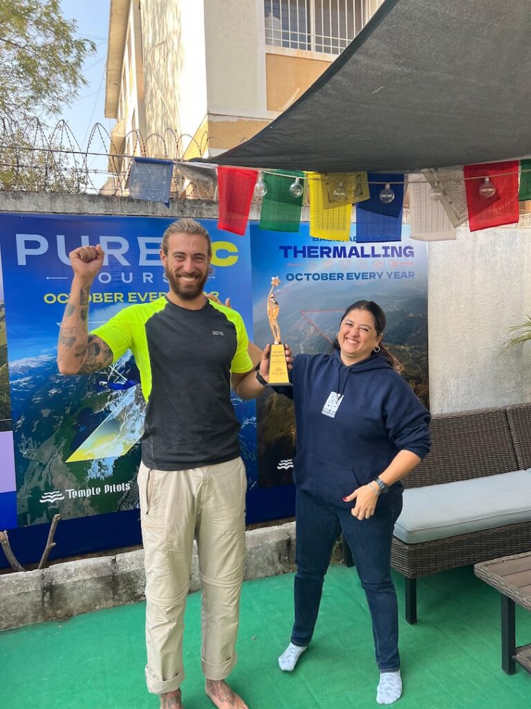 Shay from Israel Paragliding Pilot holding his trophy